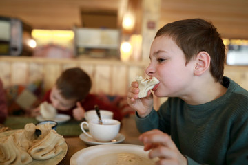 Kid eating Khinkali