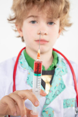 young doctor holds a syringe in his hand filled with vaccine