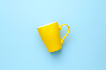 Blank cup on color background