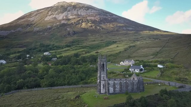 Aerial of ruined church in front of Mount Errigal, Donegal, Ireland.