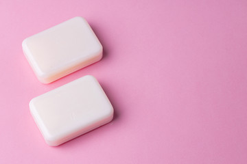 Soap bar isolated on pink background.