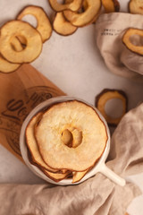 Dried fruit. Without sugar. Paste. Homemade sweets. Dried fruits. Healthy fruit snack. Pear. Pear in white bowl. Pear compositionally on a light background