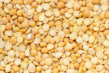 Layer of dry yellow peas. Food background of legumes.