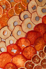 Fototapeta na wymiar Dried fruit. Without sugar. Paste. Homemade sweets. Dried fruits. Healthy fruit snack. Tangerines, persimmon, bananas,kiwi,pear,oranges