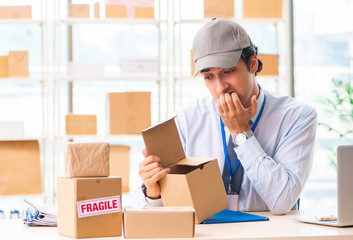 Male employee working in box delivery relocation service