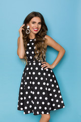 Beautiful Smiling Woman In Black Coctail Dress In White Dots