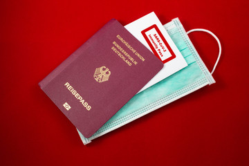 Passport with medical mask and note of sars immunity pass , concept of free traveling when immune