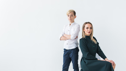 Teenager and single parent - Young mother and son together on white background with copy space.