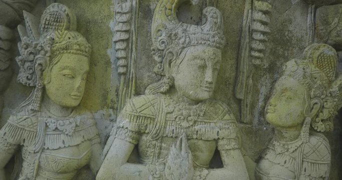 Ancient Hindu Basorelief Sculptures Scene Facade in Bali Indonesia UHD 4k