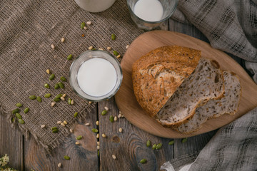 Meal with milk and bread in the country on World Milk Day. Horizontal shot top view.