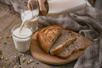 Rustic breakfast with milk and bread. World Milk Day on the first of June. Horizontal shot.