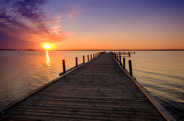 Fototapeta na wymiar Beautiful romantic sunset over a calm lake