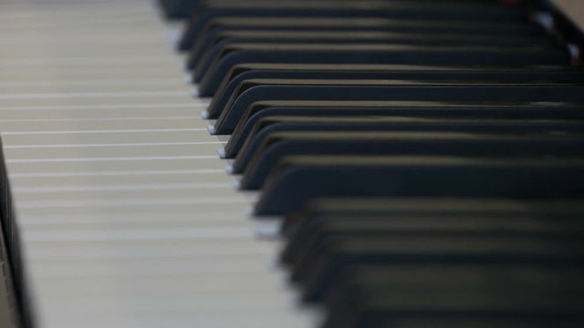 An interesting mystical self-playing piano. Black and white piano keys that play on their own