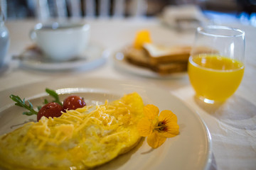 Close up image of a delicious omelet being served as breakfast in a gourmet restaurant
