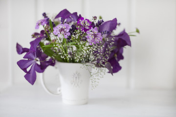 Fototapeta na wymiar Romantic Flower Bouquet In Cup