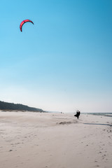 Kitesurfers on the beach in Karwia in Poland