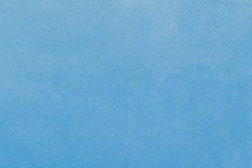 Blue non-woven fabric texture background. 