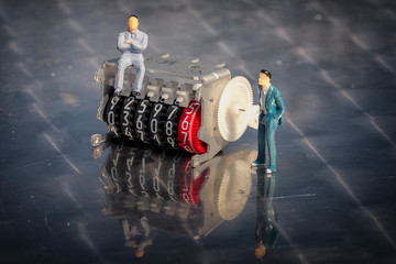 Miniature model of businessmen on an electricity meter counter with motion of the digits....