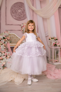 A little girl dressed elegantly played princess