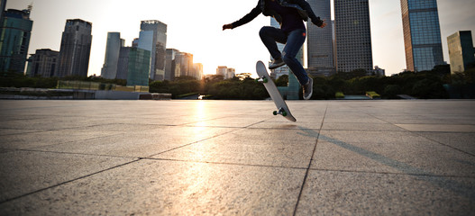 Skateboarder skateboarding at sunset city © lzf