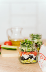 Healthy Homemade Jar Salad with cucumbers and tomatoes. Healthy food, Diet, Detox, Clean Eating or Vegetarian concept.