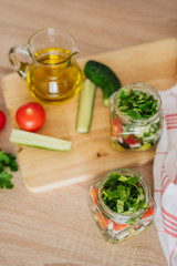 Healthy Homemade Jar Salad with cucumbers and tomatoes. Healthy food, Diet, Detox, Clean Eating or Vegetarian concept.