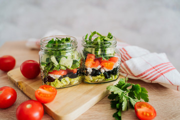 Healthy Homemade Jar Salad with cucumbers and tomatoes. Healthy food, Diet, Detox, Clean Eating or Vegetarian concept.