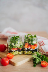 Healthy Homemade Jar Salad with cucumbers and tomatoes. Healthy food, Diet, Detox, Clean Eating or Vegetarian concept.