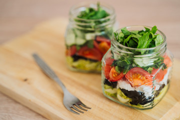 Healthy Homemade Jar Salad with cucumbers and tomatoes. Healthy food, Diet, Detox, Clean Eating or Vegetarian concept.