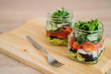 Healthy Homemade Jar Salad with cucumbers and tomatoes. Healthy food, Diet, Detox, Clean Eating or Vegetarian concept.