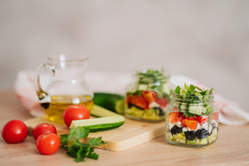 Healthy Homemade Jar Salad with cucumbers and tomatoes. Healthy food, Diet, Detox, Clean Eating or Vegetarian concept.