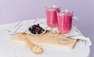 delicious berry smoothie on a wooden Board on a light background