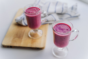 delicious berry smoothie on a wooden Board on a light background