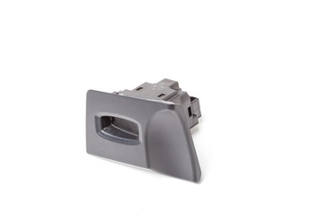 Spare part of car for replacing and repairing on a white isolated background in photo studio is an ignition switch for turning on and of electrical system, an engine power source, alarm, radio control