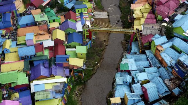 Flying above rooftops of Rainbow Village, urban revitalization in East Java