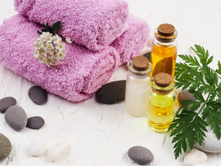 Obraz na płótnie Canvas Spa accessories with stones, Composition of spa treatment on table colorful background