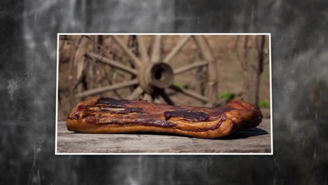 Smoked pork meat. Bacon, Ham and Sausages photo slide show on rustic background. 4K video
