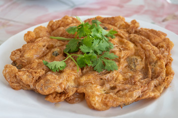 Oyster omelet  with  coriander on top.