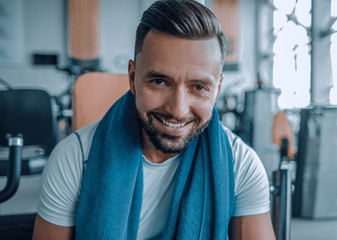 close up.portrait of a sporty young man in the gym