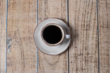Cup of coffee, espresso on a light wooden background. Cereal natural coffee.