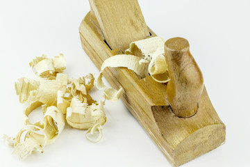Detail of traditional wooden jack-plane with wood sawdust isolated on white background. Old hand jack plane and wood chips.