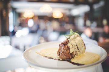 Close up image of a juicy steak in a gourmet restaurant