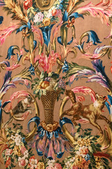 Multicolored ornament made by hand on a fabric.