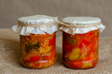 Two glass jars with canned vegetables, lecho.