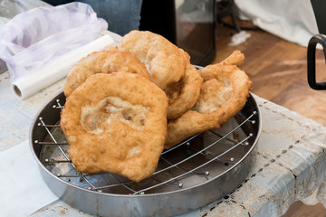 Chef preparing fried churros or donuts and pancakes during brunch buffet in the garden. Food Buffet Brunch Catering Dining Eating Party Sharing Concept