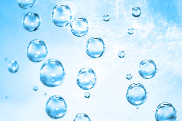 Air bubbles in blue water background, water bubbles texture, sparkling mineral water