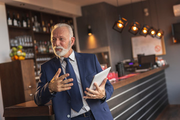 Restaurant manager having staff meeting