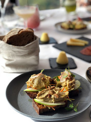 Delicious breakfast open sandwich with rye bread, apple and tuna