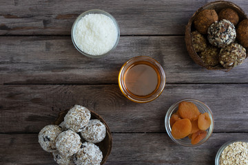 Homemade date and apricot diet sweets with banana and chia seeds in coconut flavors, healthy snack, vegan sweets