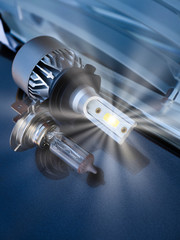 Halogen lamp and LED lamp for car headlights on the background of the headlight and body....